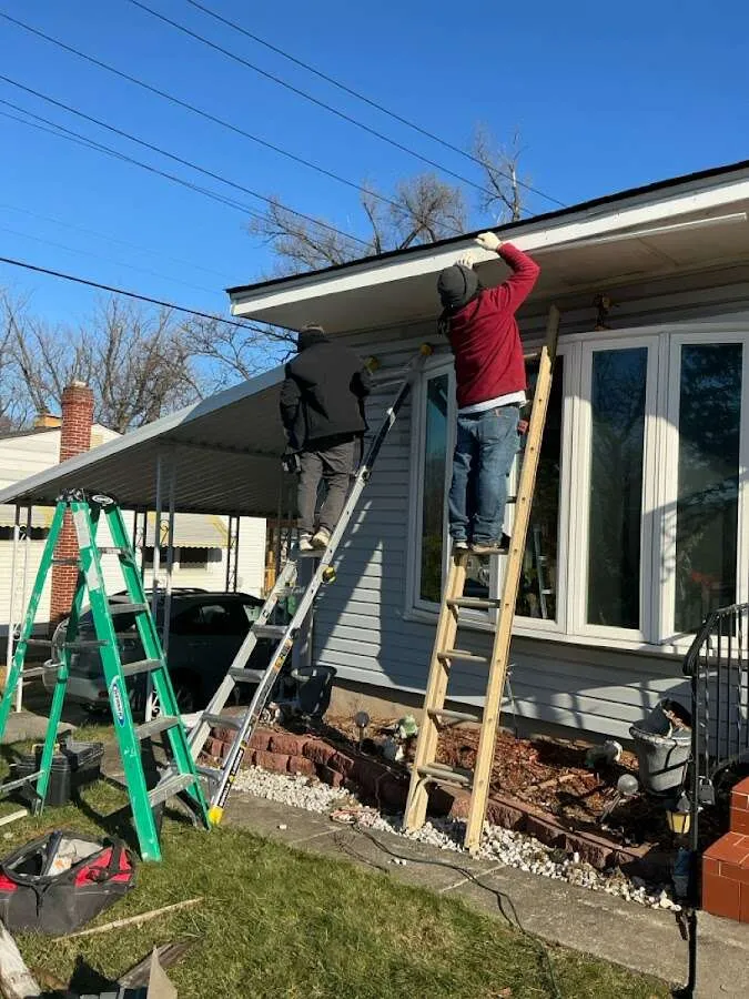 Restoration crew performing exterior repair in Arkansas City